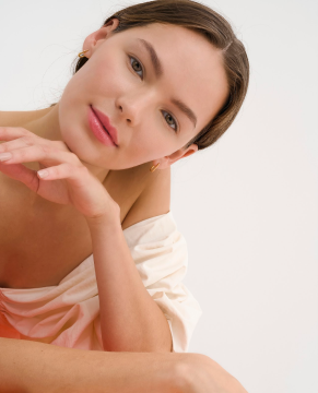 woman resting her head on her hand