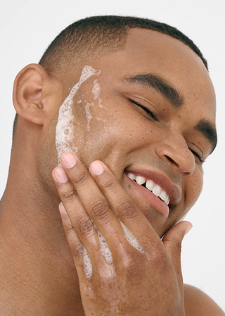 Up close of a man cleansing his face